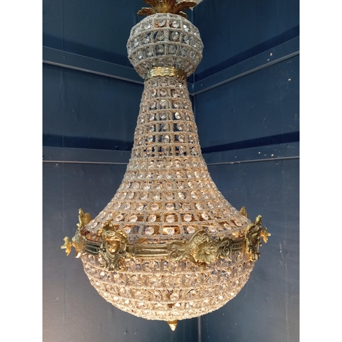 373 - Pear drop crystal and bronze six light chandelier {H 100cm x Dia 60cm}.