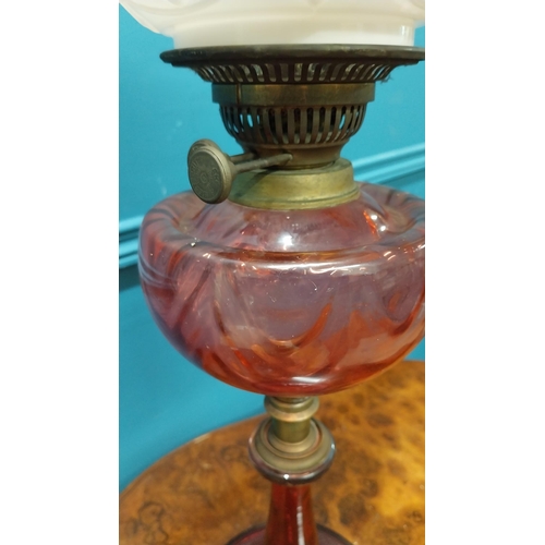 376 - 19th C. brass and ruby glass oil lamp with pink glass shade decorated with flowers {70 cm H x 18 cm ... 