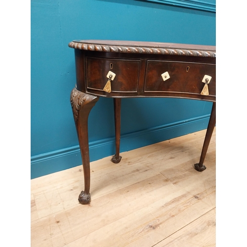 381 - Edwardian mahogany kidney shaped ladies desk with inset leather top {76 cm H x 92 cm W x 52 cm D}.