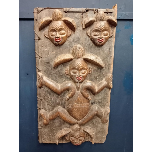 389 - African carved wooden door with female figure and heads {H 120cm x W 64cm x D 3cm }.