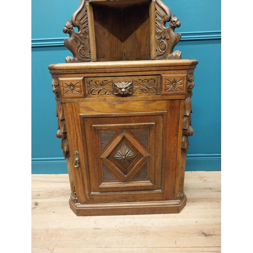 401 - Victorian carved oak corner cupboard with two blind doors and single drawer in the frieze {170 cm H ... 