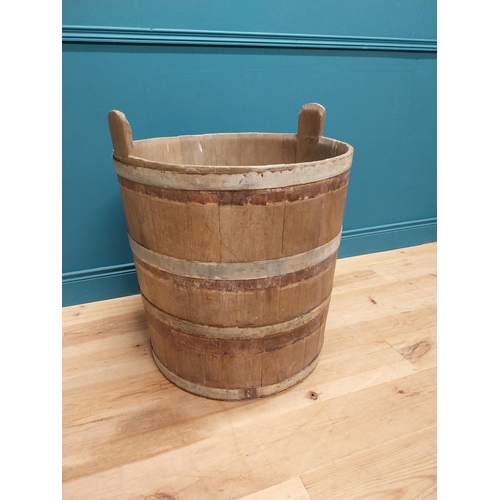 410 - Early 20th C. oak and metal bound log bucket {44 cm H x 84 cm Dia.}.