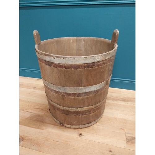 410 - Early 20th C. oak and metal bound log bucket {44 cm H x 84 cm Dia.}.