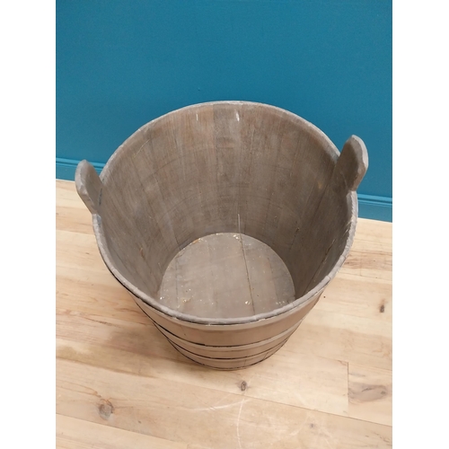 410 - Early 20th C. oak and metal bound log bucket {44 cm H x 84 cm Dia.}.