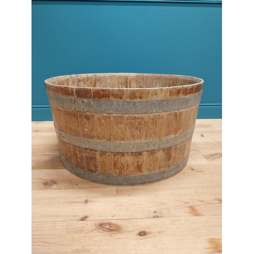 410 - Early 20th C. oak and metal bound log bucket {44 cm H x 84 cm Dia.}.