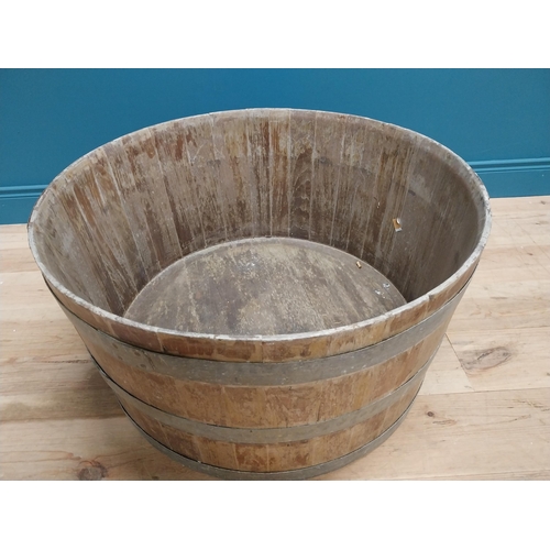 410 - Early 20th C. oak and metal bound log bucket {44 cm H x 84 cm Dia.}.