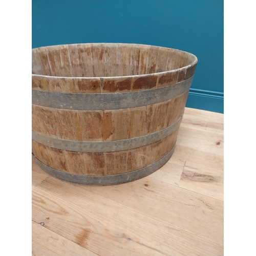 410 - Early 20th C. oak and metal bound log bucket {44 cm H x 84 cm Dia.}.