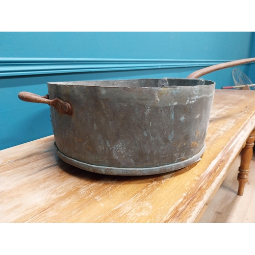 416 - Early 19th C. copper pot with wrought iron handle by Colley of Dublin {20 cm H x 77 cm W x 37 cm D{.