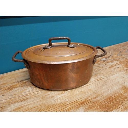 422 - Good quality 20th C. copper lidded pot with wrought iron handles {14 cm H x 26 cm W x 15 cm D}.