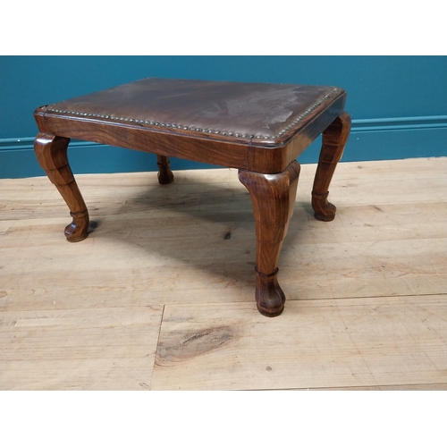 427 - Good quality walnut foot stool with inset brass studded and leather upholstered seat raised on cabri... 