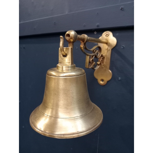 43 - 20th C. brass bell mounted on bracket  {H 19cm x W 13cm x D 20cm }.