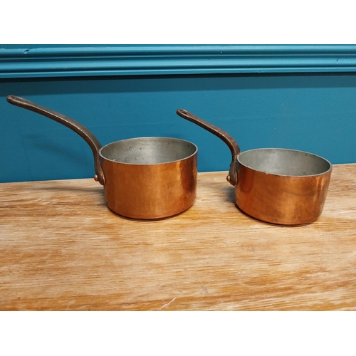 430 - Two early 20th C. hand beaten copper saucepans with wrought iron handles {16 cm H x 28 cm W x 14 cm ... 