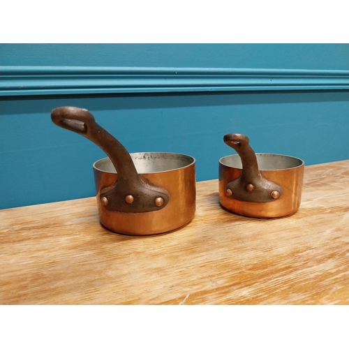 430 - Two early 20th C. hand beaten copper saucepans with wrought iron handles {16 cm H x 28 cm W x 14 cm ... 