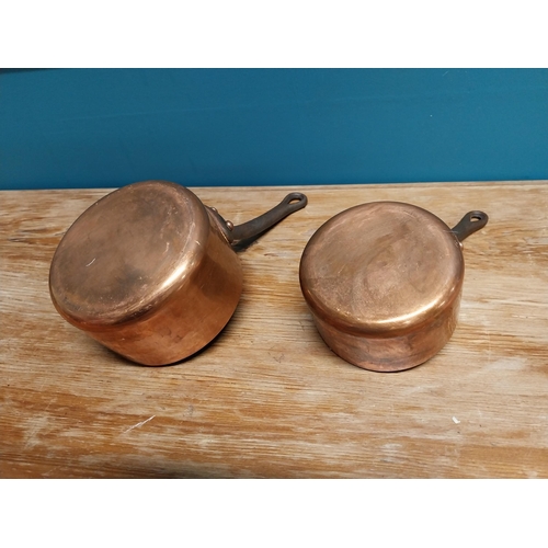 430 - Two early 20th C. hand beaten copper saucepans with wrought iron handles {16 cm H x 28 cm W x 14 cm ... 