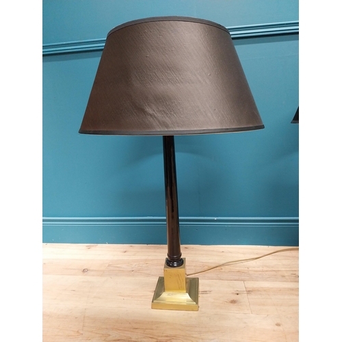 44 - Pair of good quality brass and ebonised table lamps with cloth shades {95 cm H x 55 cm Dia.}.