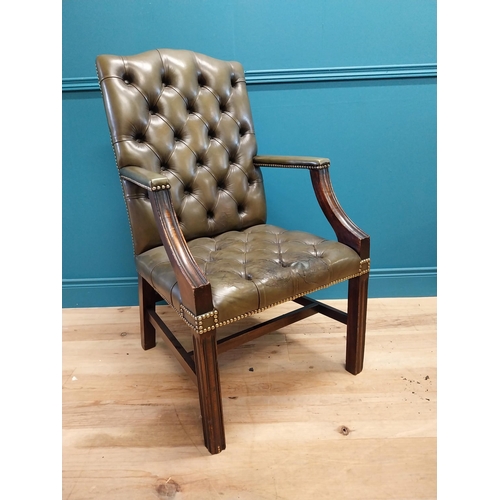 47 - Deep buttoned leather Gainsborough arm chair in the Georgian style {105 cm H x 60 cm W x 65 cm D}.