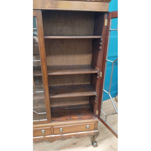 75 - Good quality Edwardian mahogany display cabinet on stand with two astral glazed doors above two shor... 