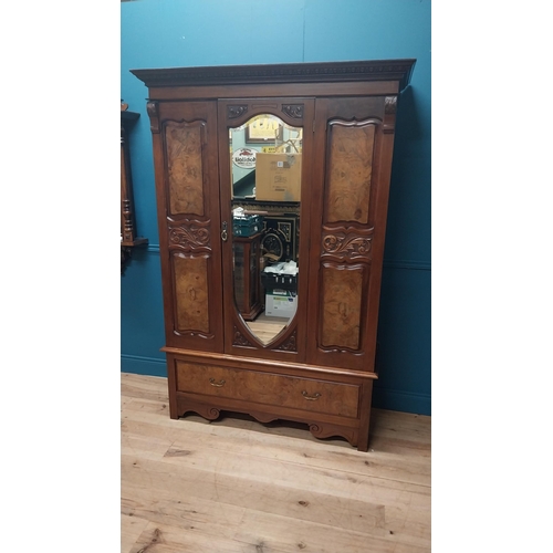 81 - Edwardian carved walnut wardrobe with single mirrored door above long drawer raised on bracket feet ... 