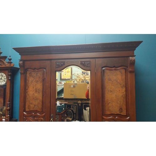 81 - Edwardian carved walnut wardrobe with single mirrored door above long drawer raised on bracket feet ... 