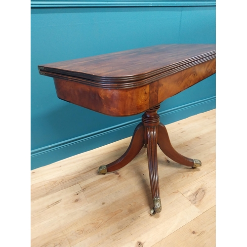 87 - Good quality Regency flamed mahogany turn over leaf card table raised on turned columns, four outswe... 