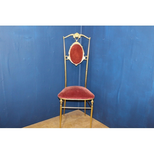 93 - Brass hall chair with red crushed draylon upholstered seat and back {H 110cm x W 42cm x D 40cm }.