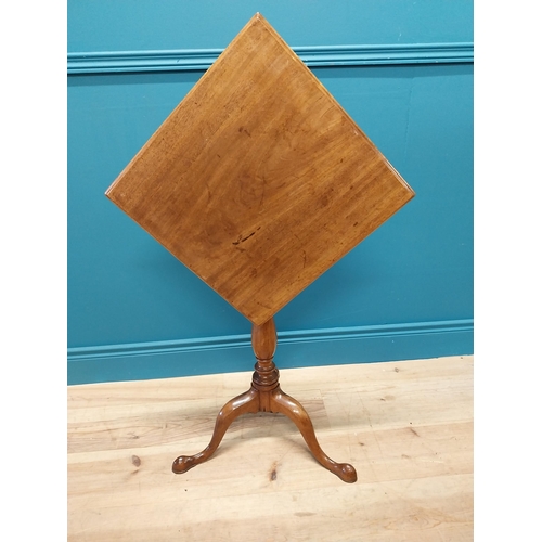 97 - 19th C. mahogany tilt top wine table raised on turned column and three outswept feet {69 cm H x 45 c... 