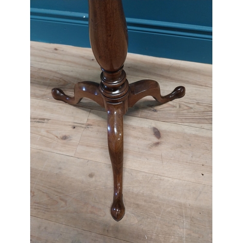 97 - 19th C. mahogany tilt top wine table raised on turned column and three outswept feet {69 cm H x 45 c... 