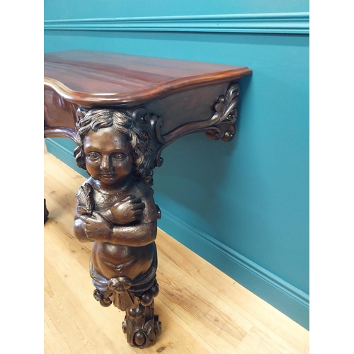 147 - Good quality Italian Victorian mahogany and carved pine console table decorated with cherubs raised ... 