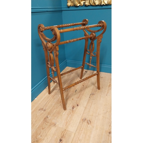 155 - Edwardian walnut towel rail raised on square tapered legs {87 cm H x 61 cm W x 41 cm D}.