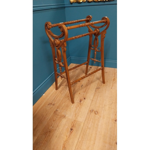 155 - Edwardian walnut towel rail raised on square tapered legs {87 cm H x 61 cm W x 41 cm D}.