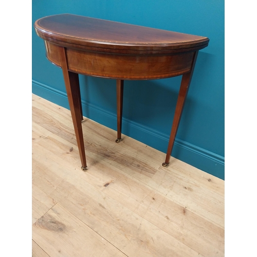 157 - Edwardian mahogany and satinwood cross banded demi lune turn over leaf card table raised on square t... 