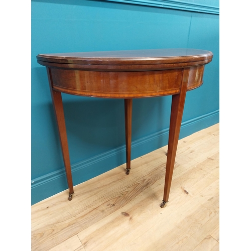 157 - Edwardian mahogany and satinwood cross banded demi lune turn over leaf card table raised on square t... 