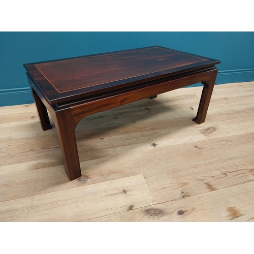 167 - Good quality mahogany and rosewood cross banded coffee table raised on square legs in the Oriental s... 