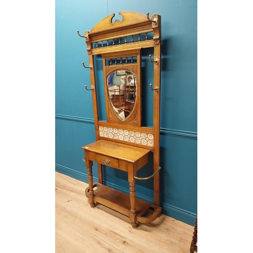 171 - Good quality Edwardian oak and brass hall stand with tiled panel raised on turned legs and platform ... 