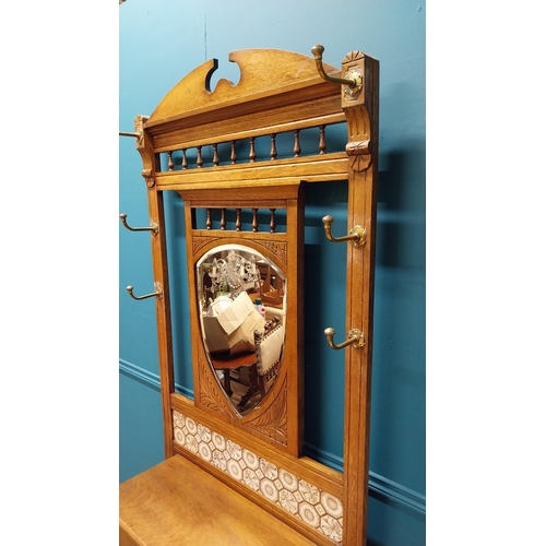 171 - Good quality Edwardian oak and brass hall stand with tiled panel raised on turned legs and platform ... 