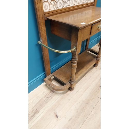 171 - Good quality Edwardian oak and brass hall stand with tiled panel raised on turned legs and platform ... 