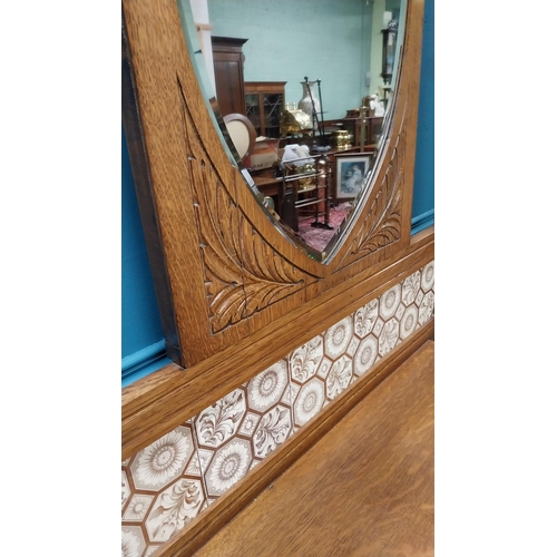 171 - Good quality Edwardian oak and brass hall stand with tiled panel raised on turned legs and platform ... 