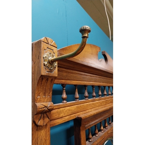 171 - Good quality Edwardian oak and brass hall stand with tiled panel raised on turned legs and platform ... 