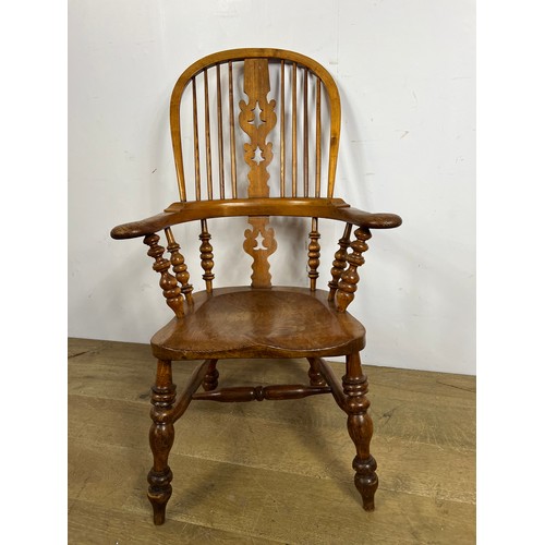 159 - Elm Windsor armchair with saddle seat  {H 110 x W 68cm x D 48cm }.