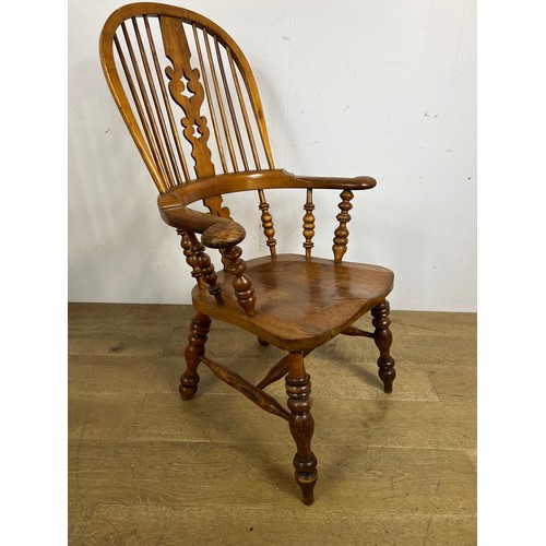 159 - Elm Windsor armchair with saddle seat  {H 110 x W 68cm x D 48cm }.