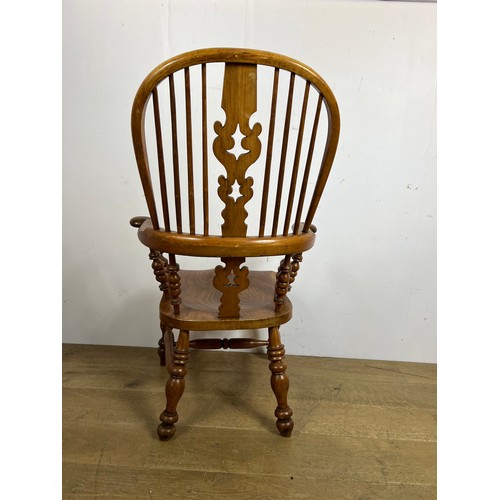 159 - Elm Windsor armchair with saddle seat  {H 110 x W 68cm x D 48cm }.