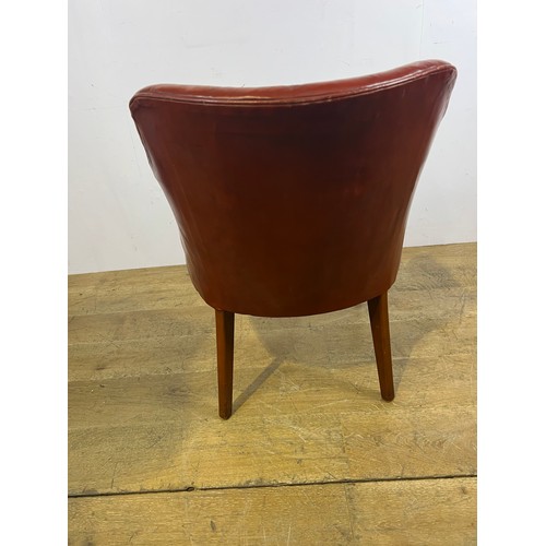 169 - Hand dyed leather deep buttoned tub chair raised on square tapered legs {H 80cm x W 62cm x D 47cm }.