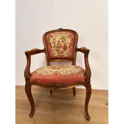 179 - French tapestry upholstered arm chair raised on cabriole legs {H 87cm x W 58cm x D 53cm }.