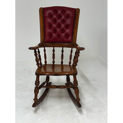 368 - Elm rocking chair with deep buttoned leather back in the Windsor style {H 107cm x W 47cm  x D 44cm }... 