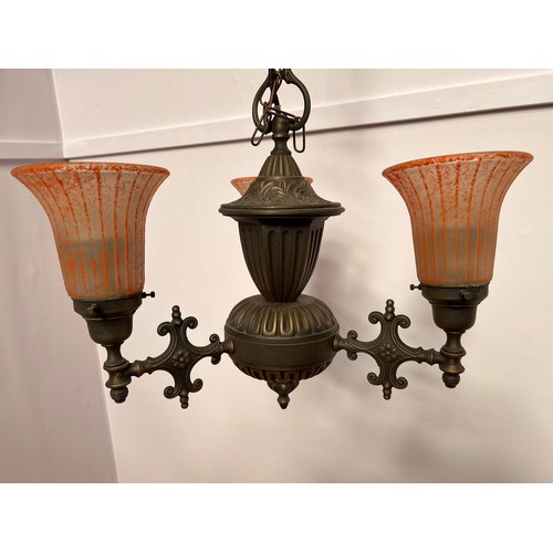 383 - Polished metal three branch chandelier with orange shades  {H 40cm x Dia 50cm}.