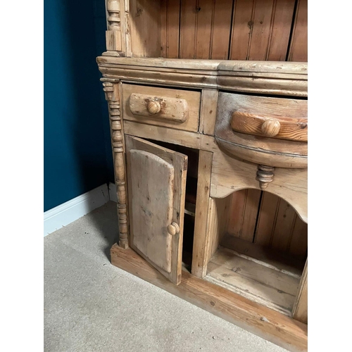 129 - 19th C. Irish Stripped pine kitchen dresser. Three drawers in the frieze above two blind doors {200c... 