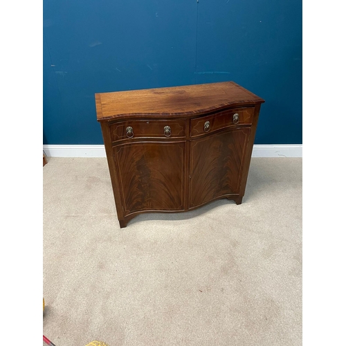 414 - Edwardian mahogany and brass inlaid serpentine front side cabinet with two drawers in the frieze abo... 