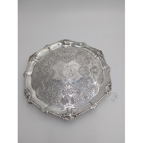 1344 - Irish silver salver, the rim decorated with an applied scroll border, the surface decorated with thr... 