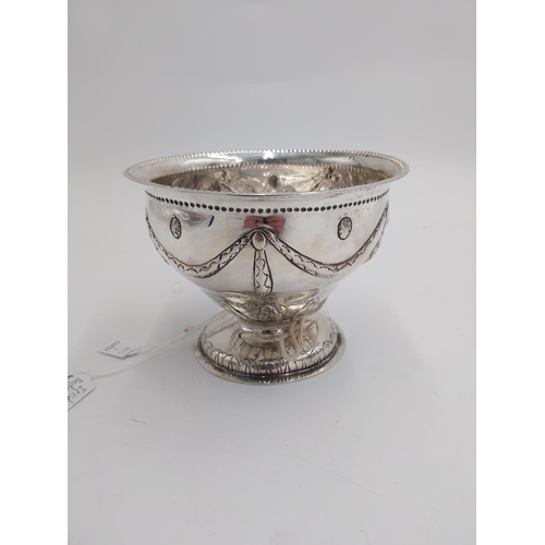 1349 - Irish silver pedestal bowl, the rim decorated with punch work beading, the body embossed with swags ... 