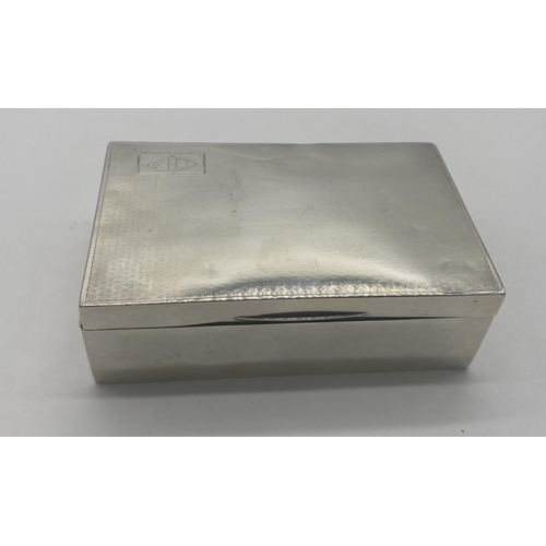 1351 - English silver cigarette box. Hallmarks rubbed. Engraved with a rectangular block enclosing a diamon... 